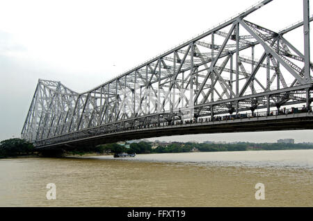 Howrah Bridge Rabindra Setu on river hooghly huge cantilever and wide bridge , Calcutta now Kolkata , West Bengal Stock Photo