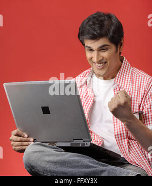 South Asian Indian man using laptop , India MR#732A Stock Photo