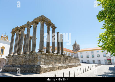Dianna Temple and cathedral tower in Evora. Ancient roman temple in the old city of Evora, Portugal Stock Photo