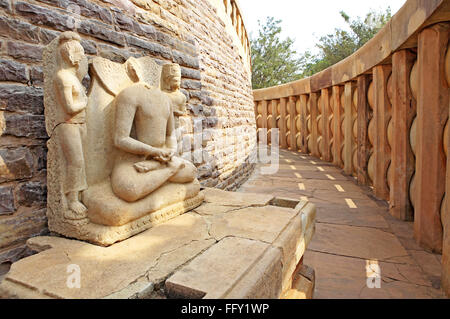 Statue of Buddha in passage encircling with railings stupa 1 , Sanchi near Bhopal , Madhya Pradesh , India Stock Photo