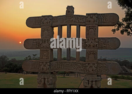 Sunset against Stupa 1 constructed by king Ashok carved gateways or torans at Sanchi , Bhopal , Madhya Pradesh , India Stock Photo