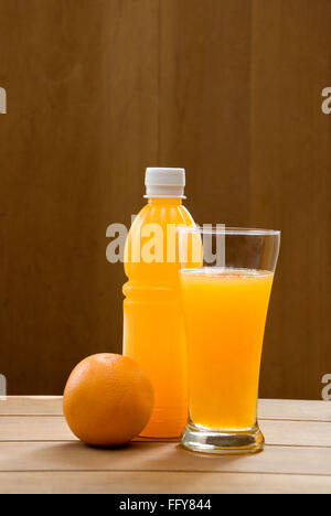 Drink , one peel orange fruit with juice in bottle and glass Stock Photo