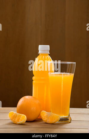Drink , one peel orange fruit with juice in bottle and glass Stock Photo