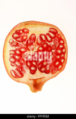 Slice of red pomegranate punica granatum ; India Stock Photo