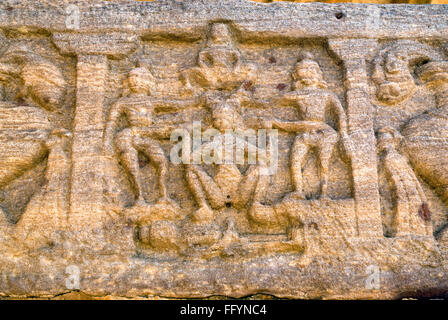 Bas Relief  on exterior wall of Huchimalligudi temple in Aihole , Karnataka , India Stock Photo