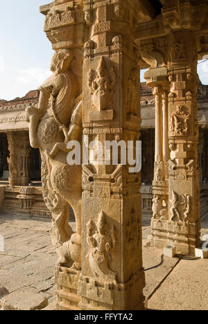 View of intricately carved monolithic pillars in Kalyana Mandap , Vittala temple , Hampi , Karnataka , India Stock Photo