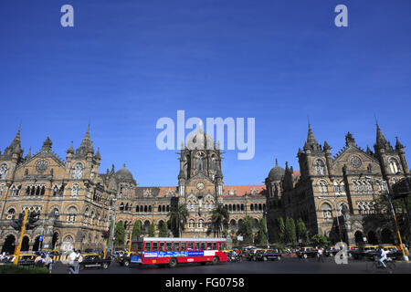 Red BEST Bus in front of Chhatrapati Shivaji  Terminus (formerly Victoria Terminus) , Bombay Mumbai , Maharashtra Stock Photo