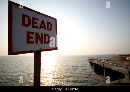 A dead end placard at the construction site Bandra Worli Sea link Arabian Sea in Western suburb of Bombay Mumbai Maharashtra Stock Photo