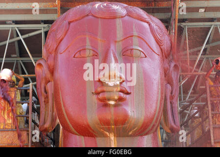 Vermilion water pouring statue saint gomateshwara bahubali in mahamasthakabhisheka Jain festival Shravanabelagola Karnataka Stock Photo