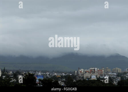 Aerial View of Pune city with Grey Clouds on Sahyadri Mountain in Rainy season Buildings Sinhgarh Road Pune Maharashtra Stock Photo
