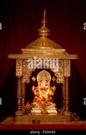 Richly decorated Idol Lord Ganesh elephant Headed Worshiping Ganapati Festival Tambadi Jogeshwari Pune Maharashtra Stock Photo