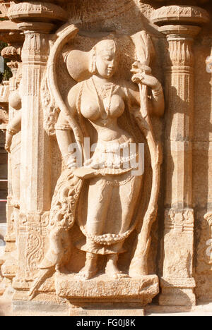 Richly carved statue of beautiful gopika milkmaid wall temple complex Sri Ranganathswami Srirangam Tiruchirapalli Tamil Nadu Stock Photo