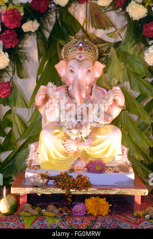 Richly decorated idol of lord Ganesh elephant headed god for Ganpati festival , Bombay Mumbai , Maharashtra , India Stock Photo