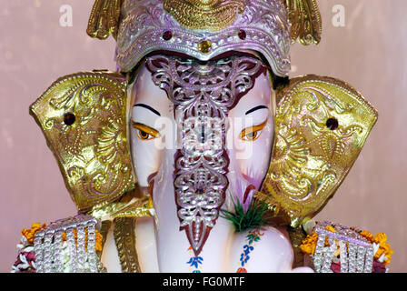 Richly decorated idol of lord Ganesh elephant headed god for Ganpati festival , Pune , Maharashtra , India Stock Photo