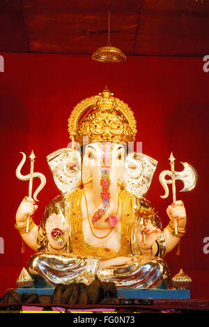 Richly decorated idol of lord ganesh elephant headed god Ganpati festival Jilabya Maruti Mandal tulsibaug Pune Maharashtra Stock Photo
