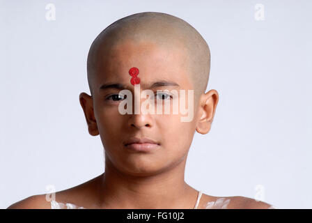 Indian hindu bald boy red tilak on forehead India MR#719 Stock Photo