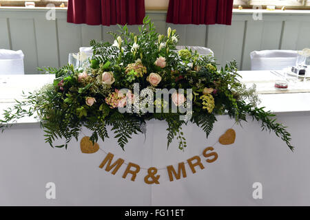 Top table at a wedding breakfast for the bride and groom, Yorkshire UK Stock Photo