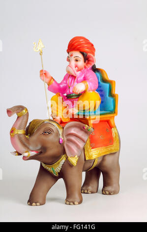 Statue of lord ganesh sitting on elephant ; India Stock Photo