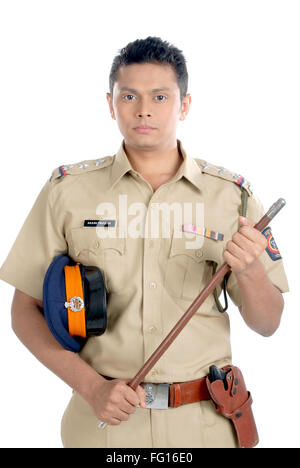 Police inspector in uniform with cap and revolver and stick in hand on white background MR#782W Stock Photo