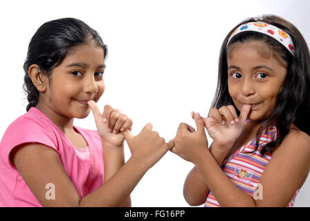 South Asian Indian sister doing naughty expression and looking at camera MR#152;364 Stock Photo