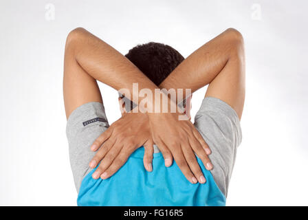 South Asian Indian man doing exercise both hands back of shoulder above wings MR#628 Stock Photo