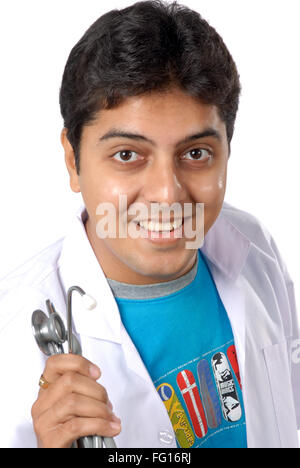 Indian doctor holding stethoscope smiling on white background MR#628 Stock Photo