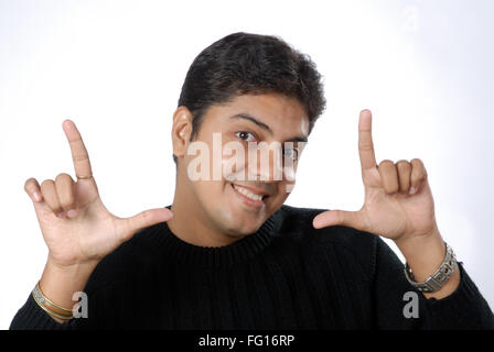 South Asian Indian man showing composition frame angel for final shoot MR#628 Stock Photo