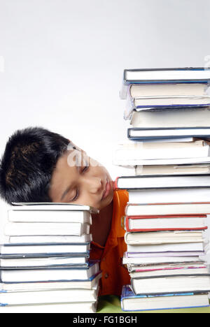 Boy resting kept head on stack of books MR#152 Stock Photo