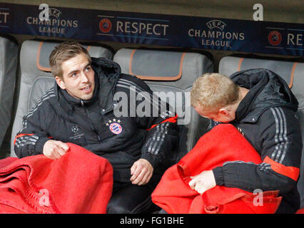 MUNICH, GERMANY - MARCH 11 2015: Bayern Munich's defender Philipp Lahm on the substitutes bench during the UEFA Champions League match between Bayern Munich and FC Shakhtar Donetsk. Stock Photo