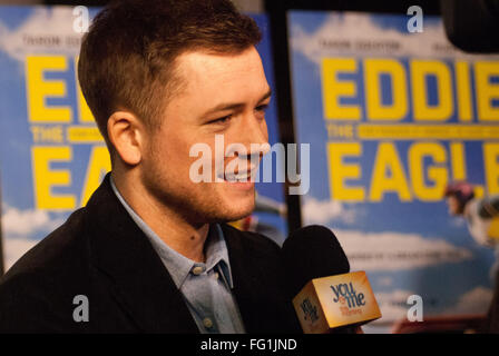 Chicago, Illinois, USA. 16th Feb, 2016. Stars of the movie Hugh Jackman and Taron Egerton with director Dexter Fletcher came to Chicago for the premiere of their new movie ''Eddie the Eagle.'' The movie is based on the true story of a British Olympic ski jumper who persevered despite the obstacles put in his way. His enthusiasm and unbounded spirit won the hearts of sports fans. Taron Egerton plays Eddie Edwards, the athlete depicted in this movie.Hugh Jackman plays his rebellious coach. Pictured: Taron Egerton being interviewed at the Chicago premiere. (Credit Image: © Karen I. Hirsch via Z Stock Photo