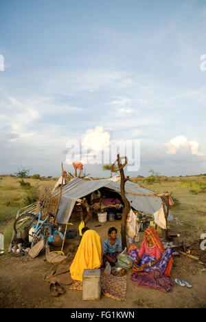 Women sitting outside the tent ; Rajasthan ; India Stock Photo