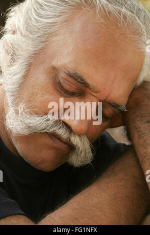 Elderly gentleman sleeping on garden bench MR#671 Stock Photo