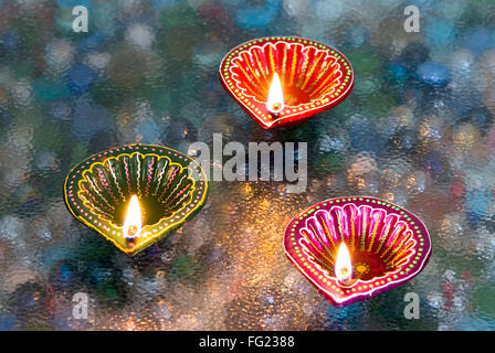 Decorated and painted in mix color oil lamps used in Diwali deepawali festival Stock Photo