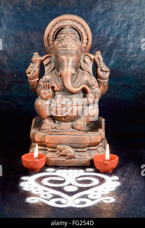 Sculpture of ganesh with oil lamp ; India Stock Photo