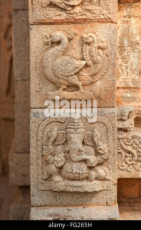 Sculpture of ganesh and peacock on the wall of vitthal temple ; Hampi ; Karnataka ; India Stock Photo