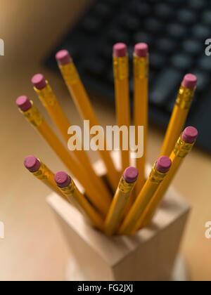 wooden pencil with eraser tip in holder Stock Photo