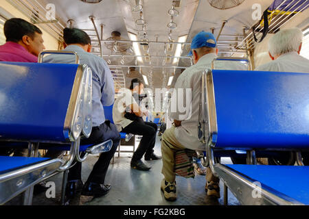 Passengers in a Mumbai suburban train Stock Photo