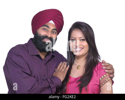 Sikh man and woman standing close to each other MR#702Z;779A Stock Photo