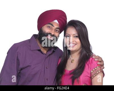 Sikh man and woman standing close to each other MR#702Z;779A Stock Photo