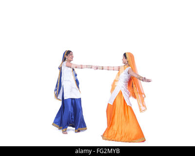 Young Punjabi Women Doing Bhangra Dance With Drum On White Background.  23295106 Vector Art at Vecteezy