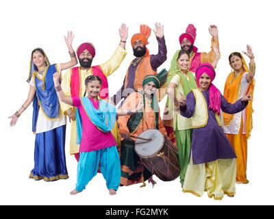 Dancers with sikh family performing folk dance bhangra MR#702X;702Y;702Z;779A;779D;779C;779B;779E;779F Stock Photo