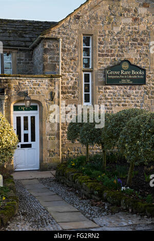 Pathway and entrance to Grove Rare Books, Bolton Abbey, North Yorkshire, England - a beautiful, quaint, 18thC stone building. Stock Photo