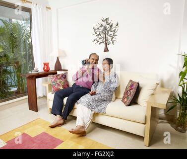 Old couple recording movement in digital camera MR#702T,702S Stock Photo