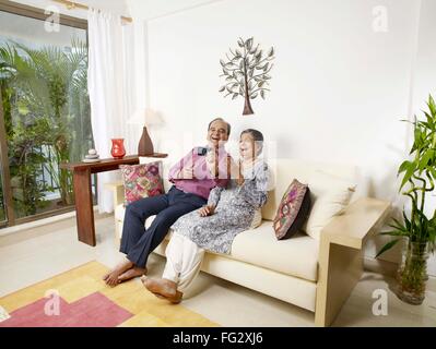 Old couple recording movement in digital camera MR#702T,702S Stock Photo