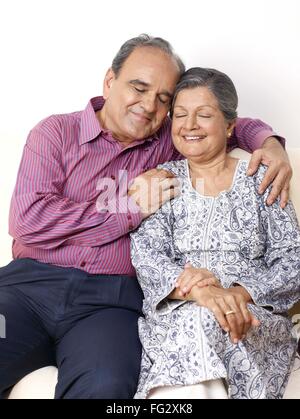 Old couple embracing, senior man woman, senior husband wife, MR#702T,702S Stock Photo