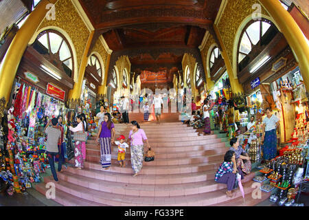 Entrance passage and shops at the Shwedagon Pagoda, Yangon, Myanmar Stock Photo