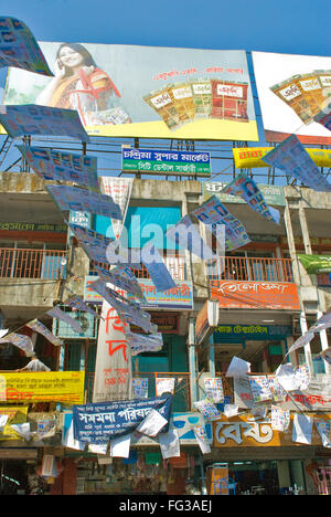 Advertising hoardings and banners and pamphlets hanging around in New Market ; Dhaka ; Bangladesh Stock Photo