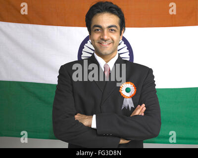 Executive folded hands standing in front of national flag of India MR#702A Stock Photo