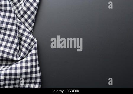 black checkered napkin on black table Stock Photo