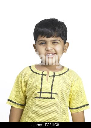 Indian boy making a funny face Stock Photo - Alamy